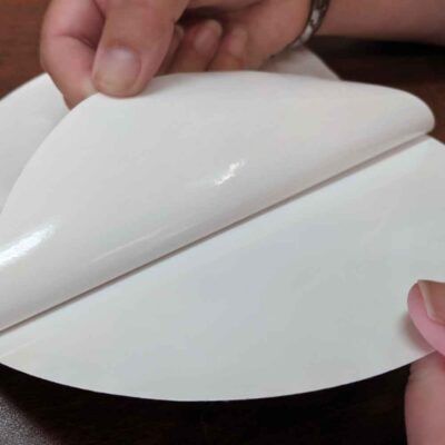 close up of 1/32" non marking adhesive backing on plastic pad